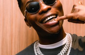 Reekado Banks fires back after critic mocks him for attending church