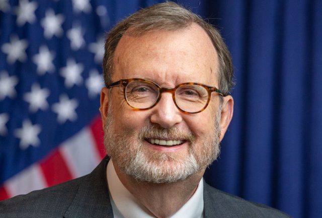 Ambassador_Richard_Mills_Jr._Official_Portrait-e1766390765691.jpg